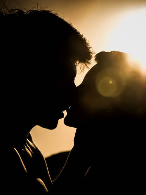 Couple kissing wallpaper for mobiles and tablets