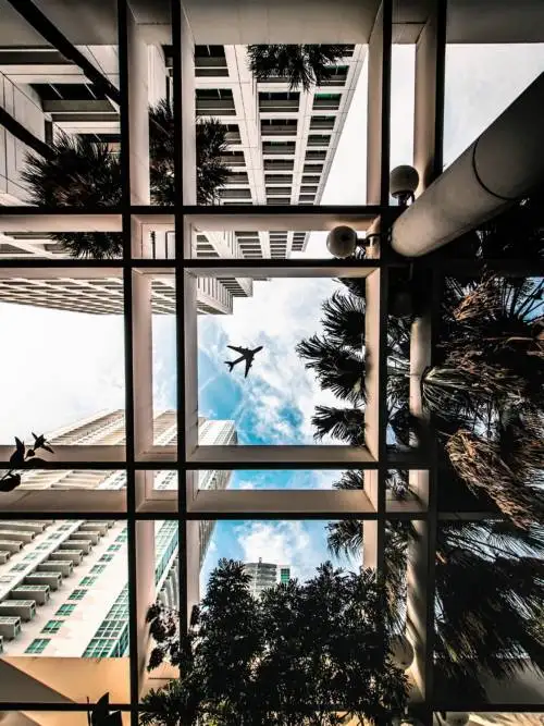 Plane between buildings wallpaper