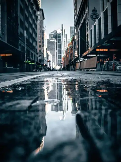 Street reflected in puddle wallpaper