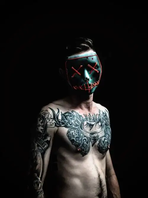Tattooed man with mask wallpaper