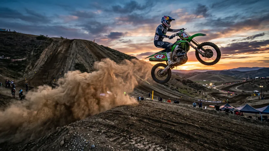 Motocross Rider Jumping at Sunset