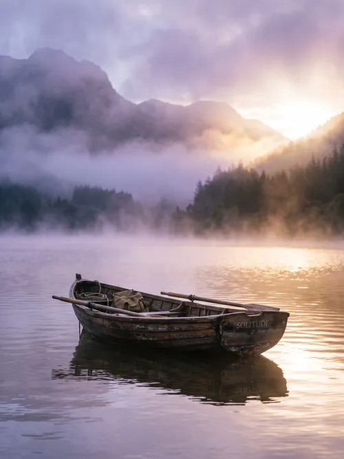 Solitary Boat on Misty Lake