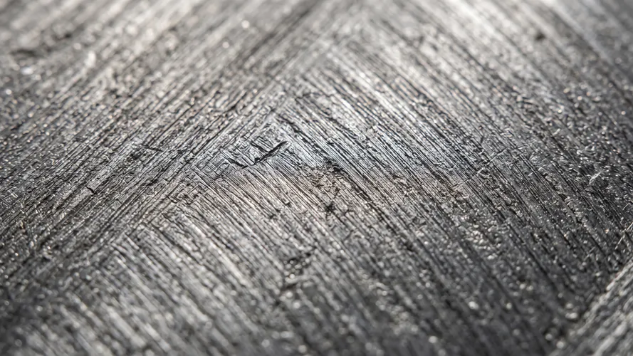 Fond de surface métallique sombre texturée